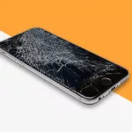 Damaged phone for repair with orange & white colour in background
