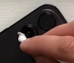 Removing adhesive through earbud